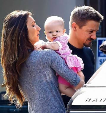 Six months old Ava Berlin Renner with her parents Jeremy Renner and Sonni Pacheco in 2013.
